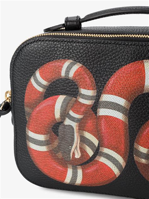 gucci bag with snake buckle.